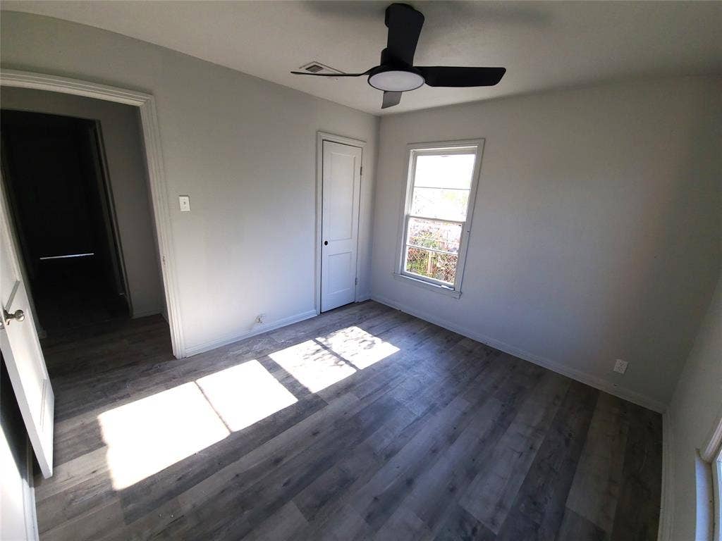 519 Dearborn Street, Waco, TX 76704 Bedroom #2 with dark wood finished floors, ceiling fan, and a closet