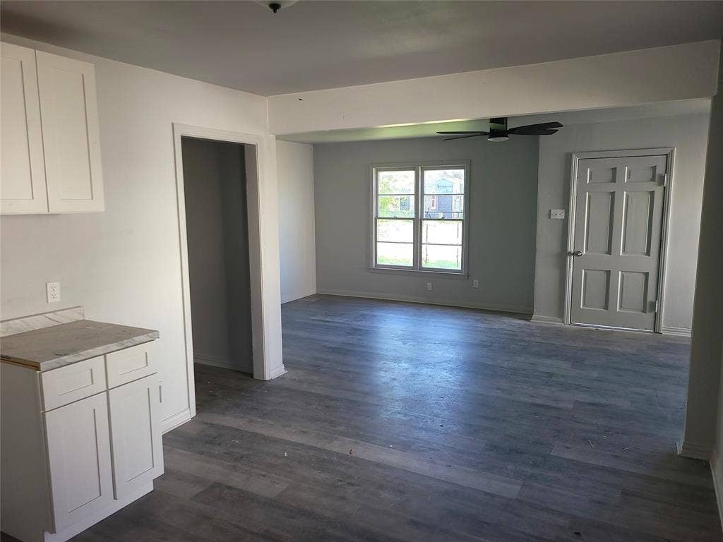 519 Dearborn Street, Waco, TX 76704 Unfurnished Kitchen/Living area with a ceiling fan and dark wood finished floors
