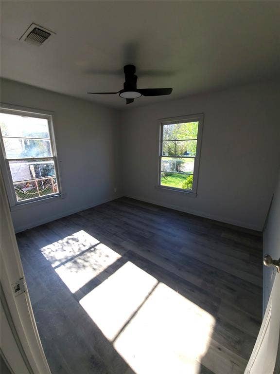 519 Dearborn Street, Waco, TX 76704 Bedroom#2 with dark wood-style flooring, healthy amount of natural light, and ceiling fan