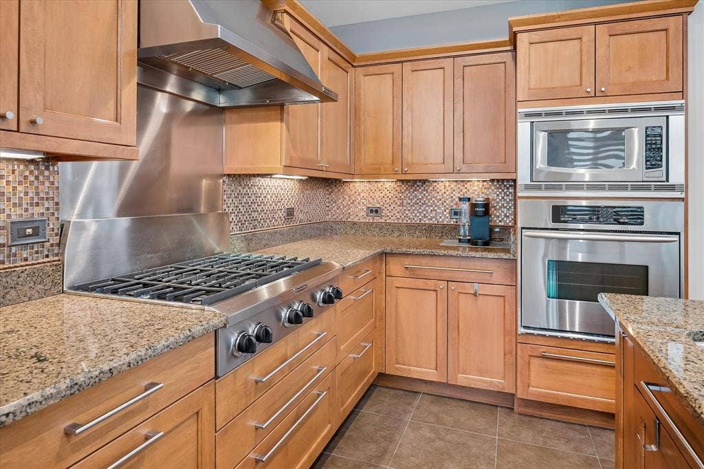 5656 N Central Expressway, #601, Dallas, TX 75206 All stainless steel appliances including six burner gas cooktop.