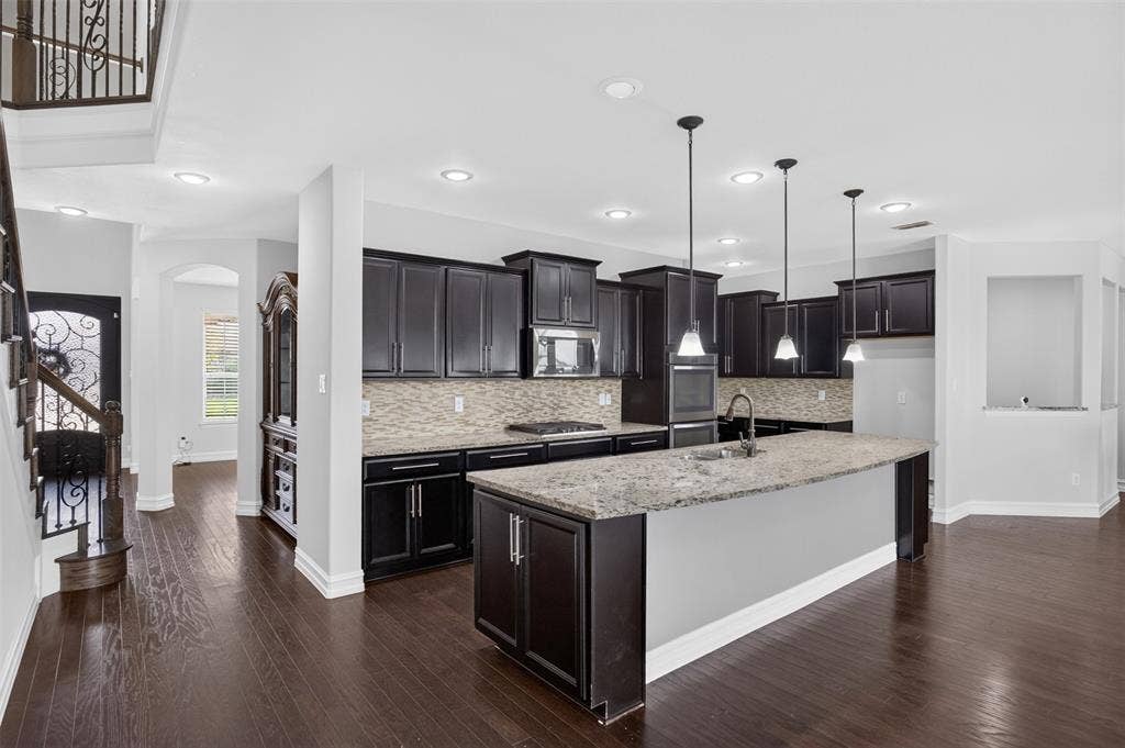 8125 Charford Drive, Fort Worth, TX 76131 KITCHEN WITH GRANITE COUNTERTOPS AND LARGE ISLAND