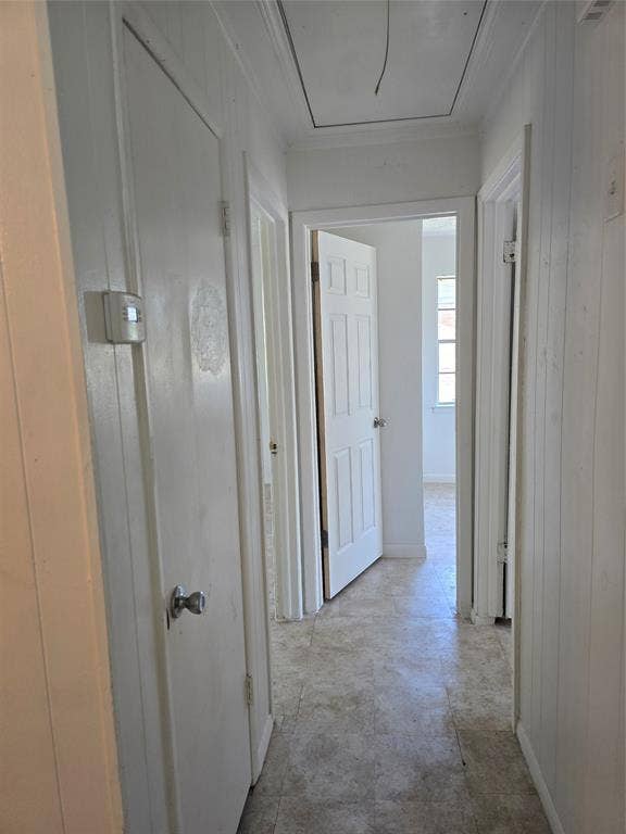 409 Monica Drive, Garland, TX 75041 Hallway featuring paneling and neutral-toned flooring
