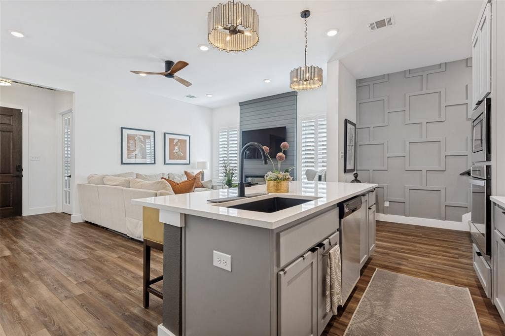 3509 The Commons Parkway, Sachse, TX 75048 Gourmet kitchen island with an undermount sink and stainless steel appliances
