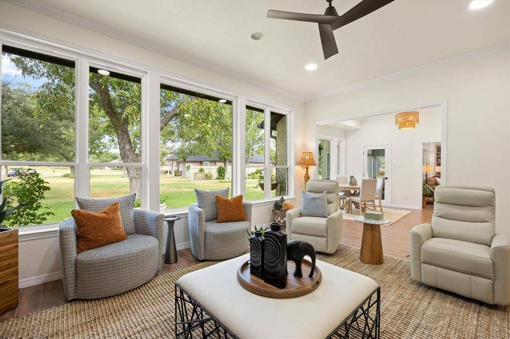 9604 Champions Drive, Granbury, TX 76049 Oversized Den with Wall of Windows Overlooking Golf Course Green and Fountain