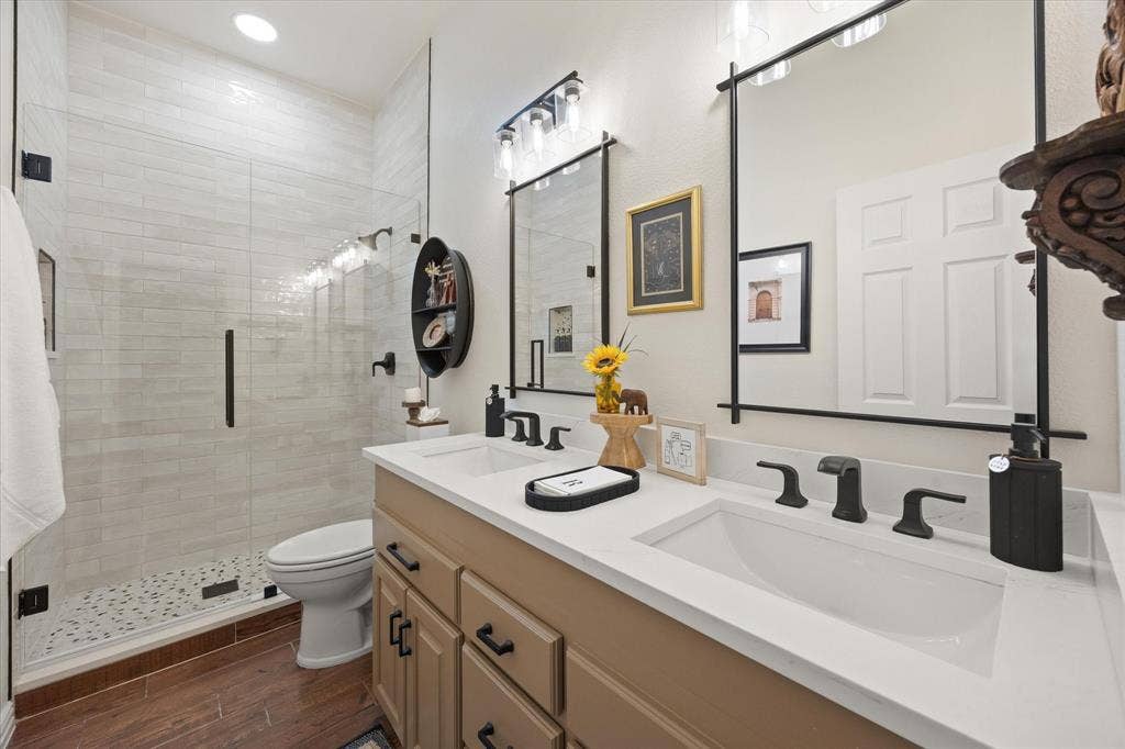 9604 Champions Drive, Granbury, TX 76049 Updated Secondary Bathroom Featuring Oversized Shower with Frameless Glass Door, Quartz Countertop, Kohler Fixtures, Framed Mirrors and Designer Light Fixtures