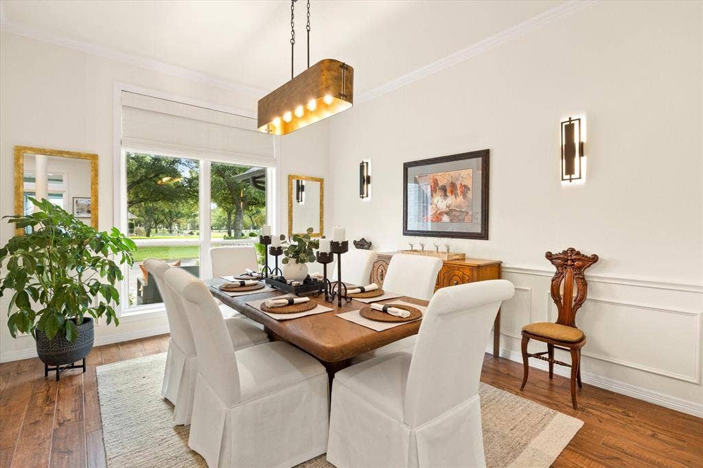 9604 Champions Drive, Granbury, TX 76049 Beautiful Light and Bright Dining with Designer Light Fixtures. Perfect for Entertaining!
