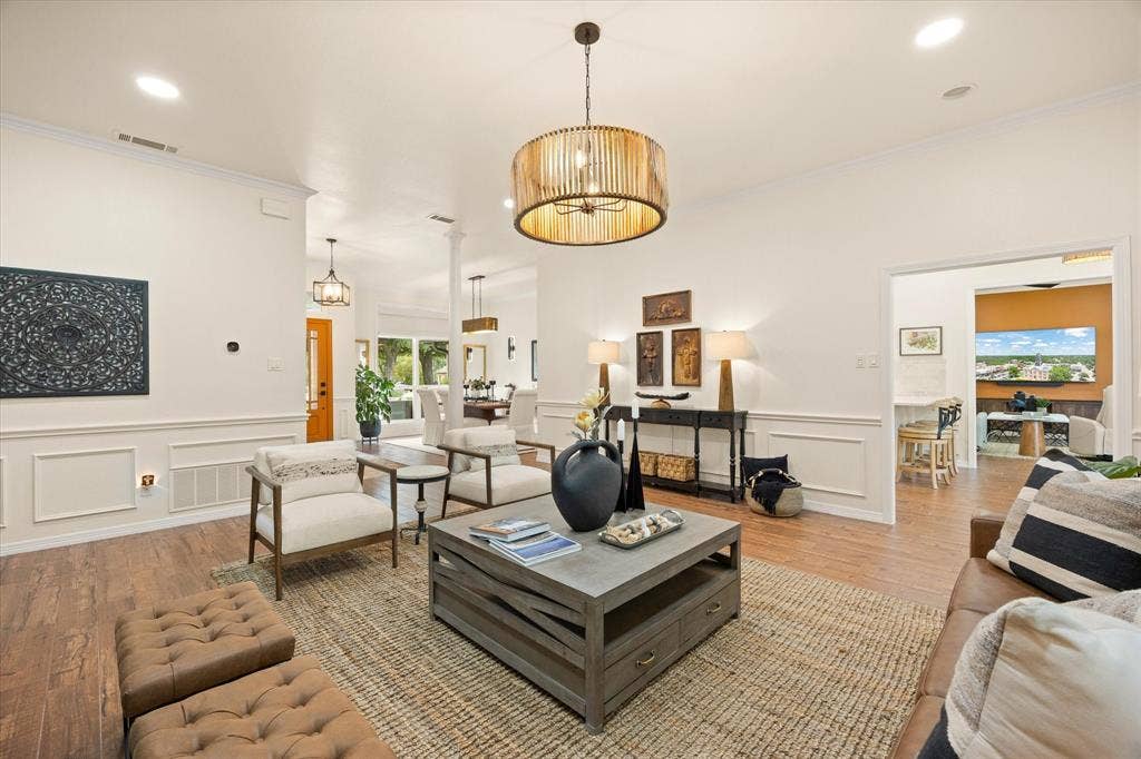 9604 Champions Drive, Granbury, TX 76049 Another View of the Great Room Leading to Kitchen and Den