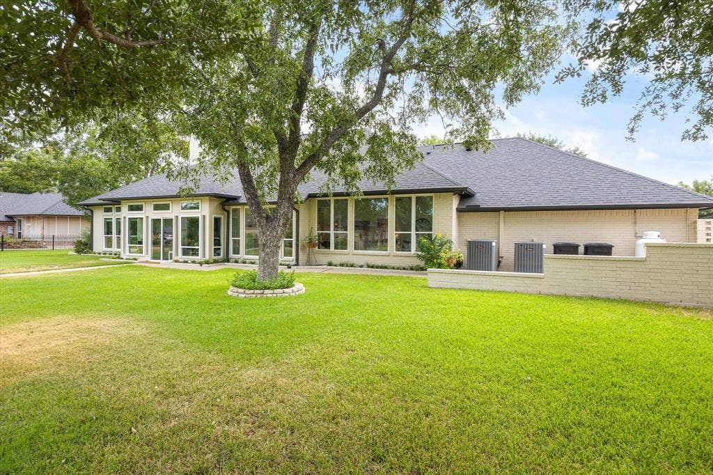 9604 Champions Drive, Granbury, TX 76049 Wall of Windows Across Rear of Home Overlook Golf Course and Mature Trees