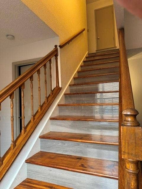 1432 Palmnold Circle W, Fort Worth, TX 76120 Hand Stained Staircase