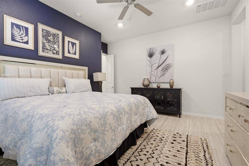 4808 Forest Crest Parkway, Arlington, TX 76005 Recessed lighting, ceiling fan, wood-finish flooring, accent wall, and a paneled headboard