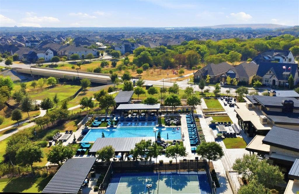4808 Forest Crest Parkway, Arlington, TX 76005 Outdoor recreational area featuring multiple swimming pools, tennis courts, and landscaped green spaces