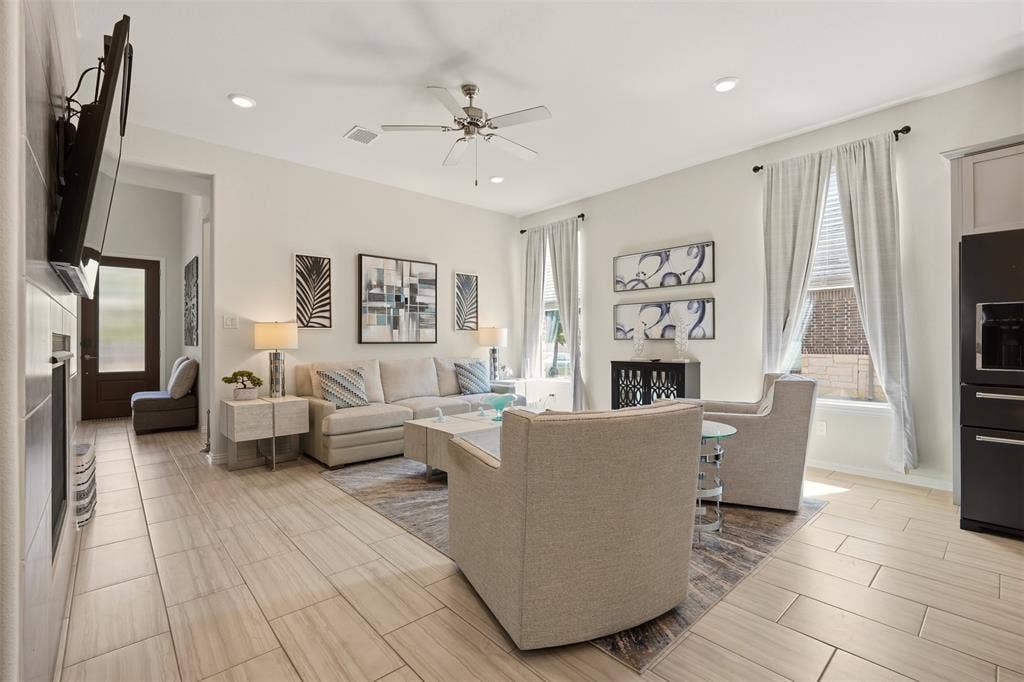 4808 Forest Crest Parkway, Arlington, TX 76005 Open-concept living area featuring light-toned tile flooring, recessed lighting, and a ceiling fan