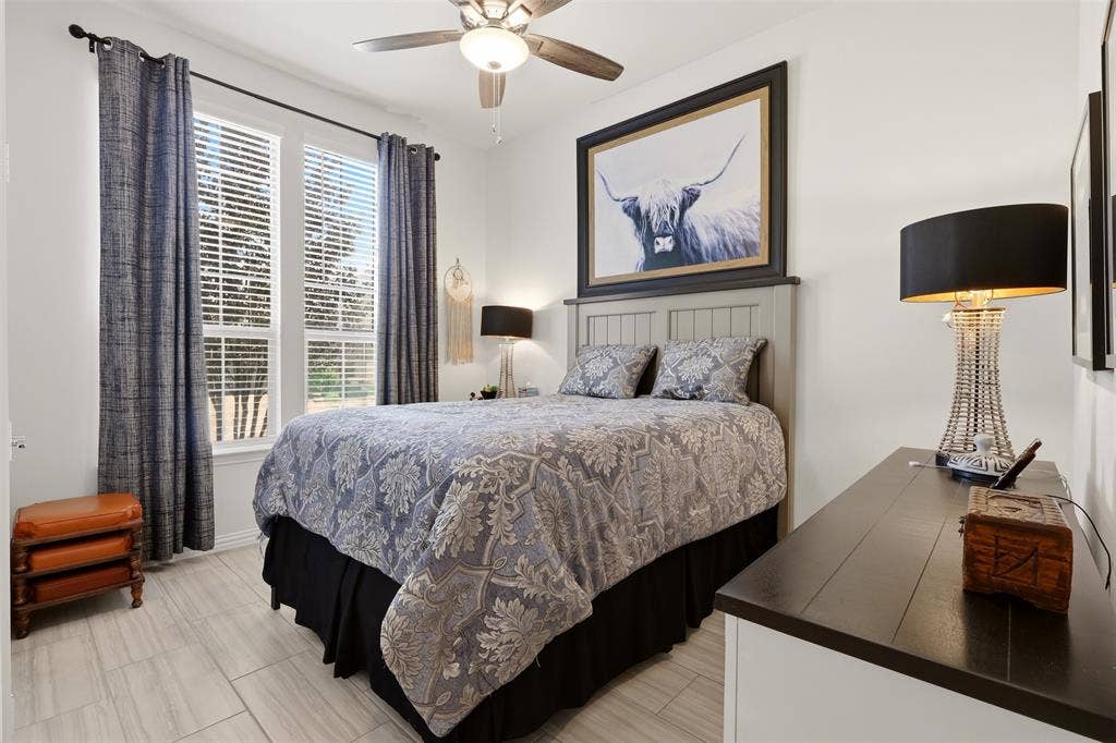 4808 Forest Crest Parkway, Arlington, TX 76005 Room featuring two windows with blinds, a ceiling fan with integrated lighting, and light-toned tile flooring