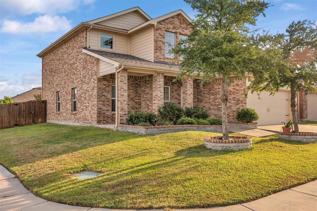 Brick exterior with light-colored siding accents