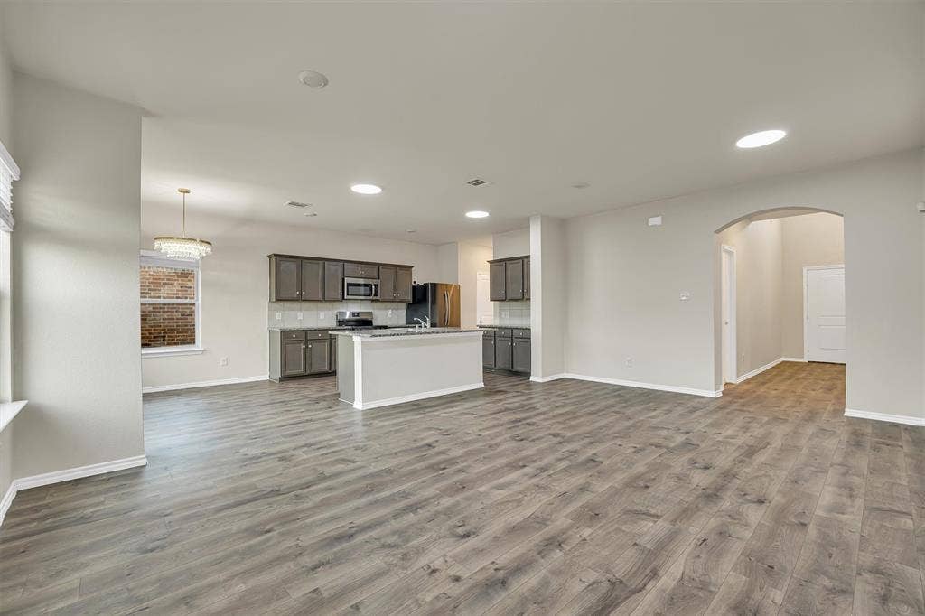 Open concept layout with wood-finish flooring