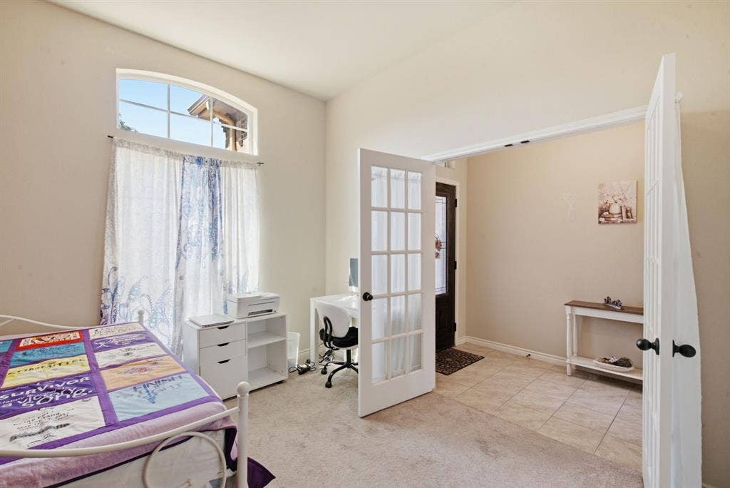 3112 White Horse Court, Granbury, TX 76049 LOVELY FIRST BEDROOM WITH PRETTY DOORS