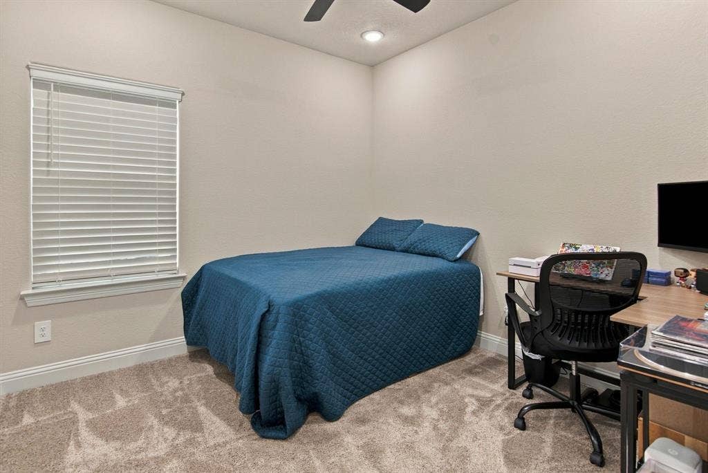 4822 Wichita Street, Granbury, TX 76048 Recessed lighting, ceiling fan, window with blinds, and neutral-toned carpet