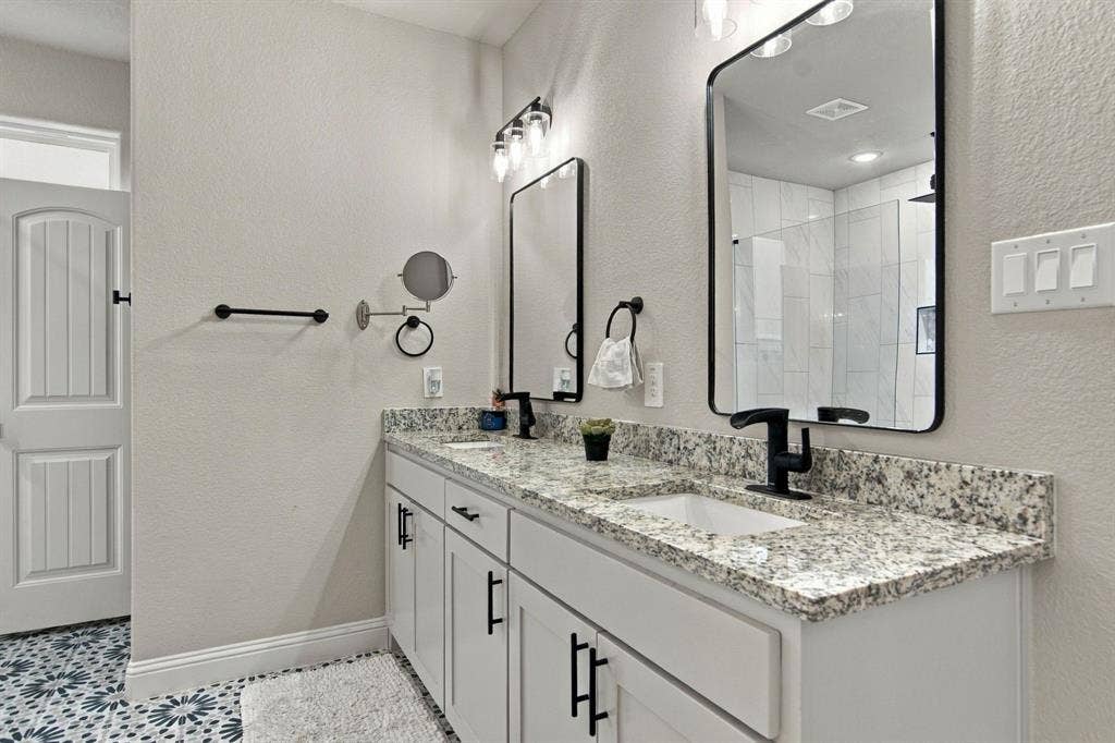 4822 Wichita Street, Granbury, TX 76048 Dual vanity with stone-finish countertops and integrated sinks