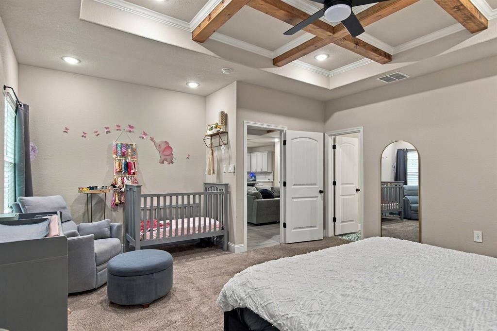 4822 Wichita Street, Granbury, TX 76048 Tray ceiling with exposed wood beams and recessed lighting
