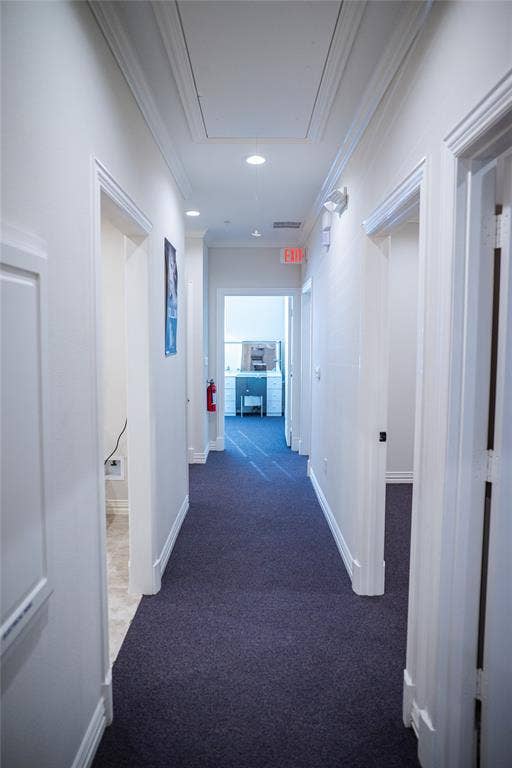 8668 John Hickman Parkway, #906, Frisco, TX 75034 Hallway with recessed lighting, crown molding, and dark carpet flooring