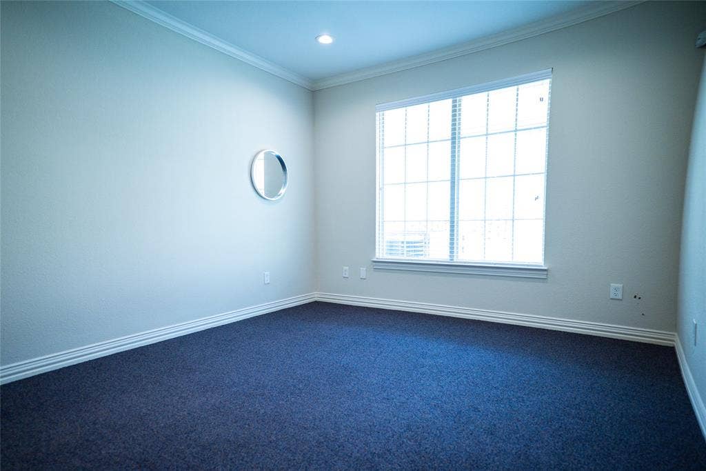 8668 John Hickman Parkway, #906, Frisco, TX 75034 Recessed lighting, crown molding, white trim, and dark blue carpeting