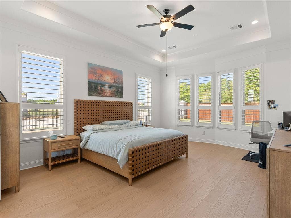 1020 Williams Lane, Copper Canyon, TX 75077 Spacious primary bedroom downstairs with hardwood flooring and custom shutters