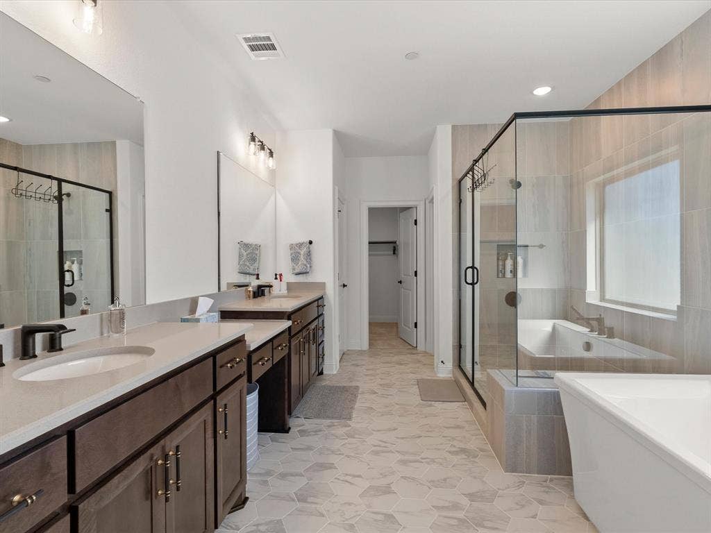 1020 Williams Lane, Copper Canyon, TX 75077 Primary bathroom off the second primary bedroom upstairs features a large walk in shower, tub , double vanity , large walk in closet