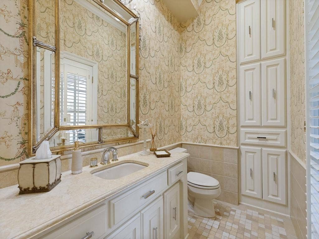 Vanity with integrated sink, polished chrome faucet, and ample storage