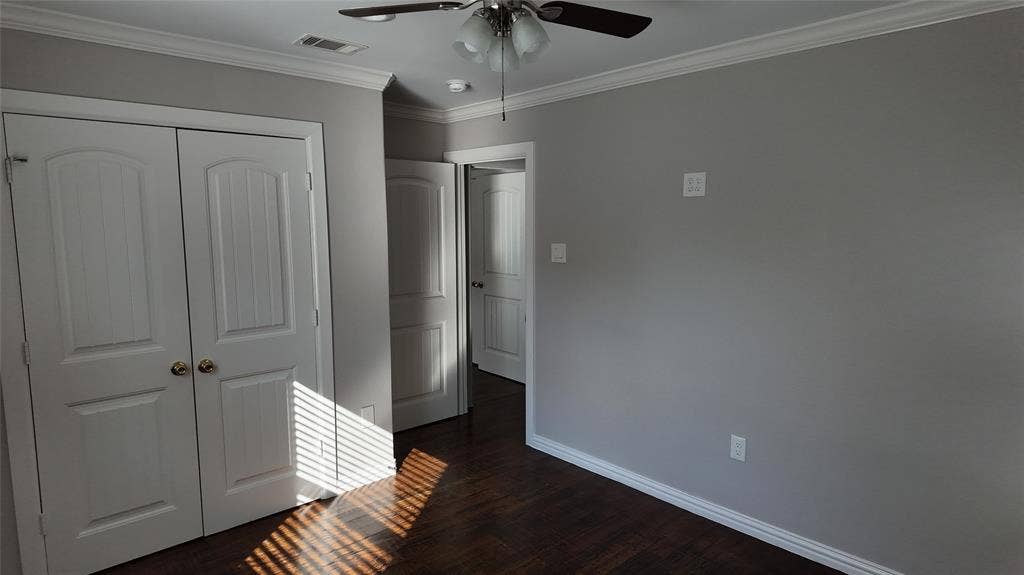3602 Palm Drive, Mesquite, TX 75150 Wood-finish flooring, white crown molding, and a ceiling fan