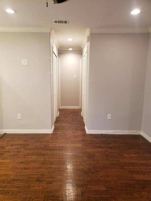 3602 Palm Drive, Mesquite, TX 75150 Wood-finish flooring, recessed lighting, crown molding, and two louvered closet doors