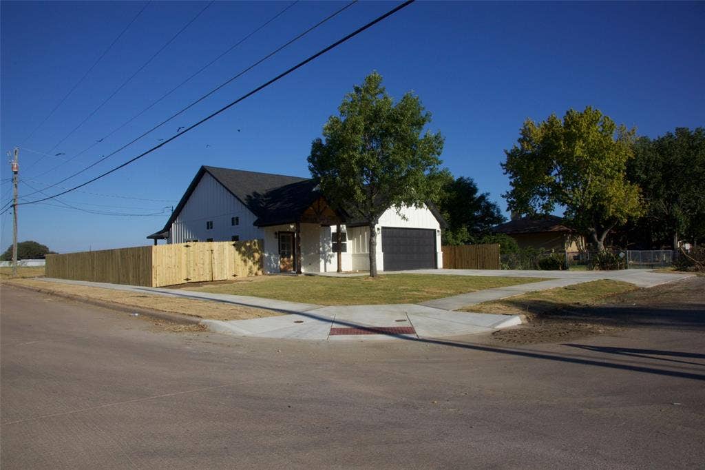 9432 PRAIRIEVIEW Drive, Crowley, TX 76134 Modern farmhouse-style residence featuring white siding and a dark shingle roof