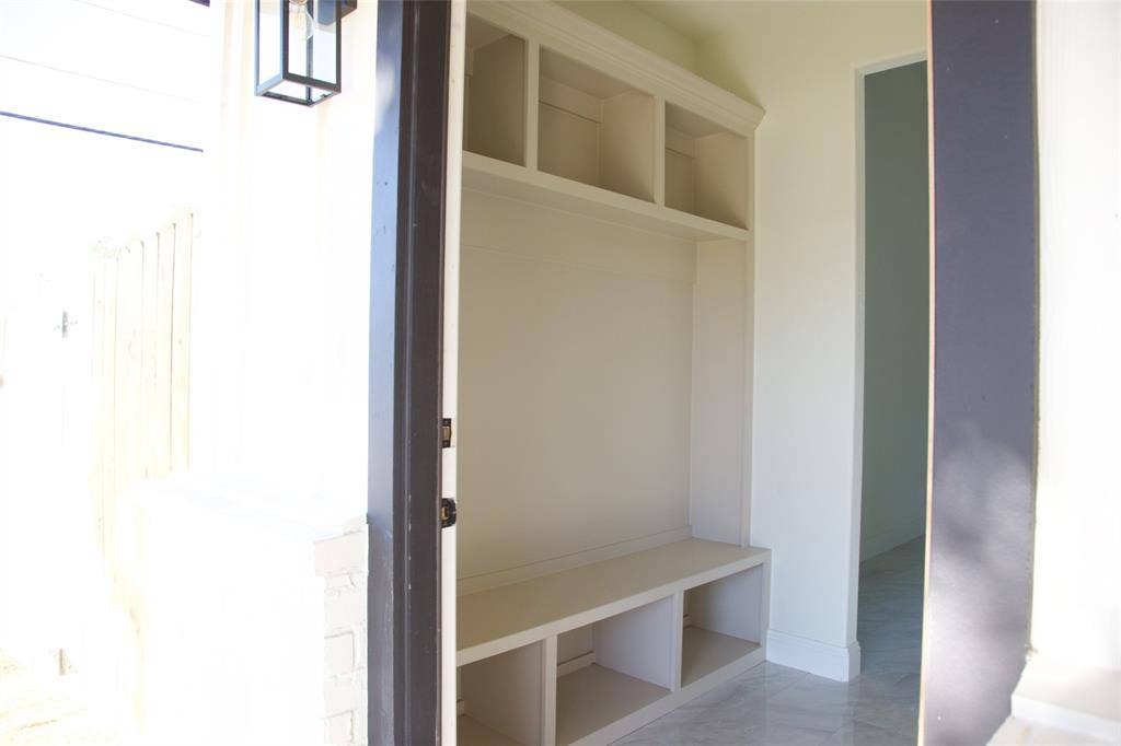 9432 PRAIRIEVIEW Drive, Crowley, TX 76134 Built-in storage bench with overhead shelving