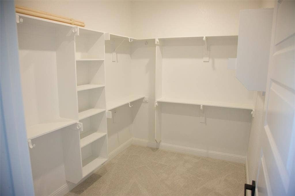 9432 PRAIRIEVIEW Drive, Crowley, TX 76134 Built-in shelving, carpeted flooring, and white walls