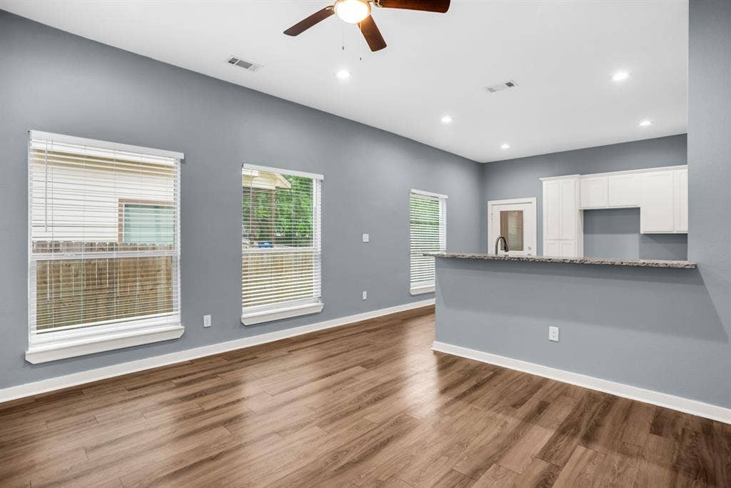 440 Pecan Hollow, Garrett, TX 75119 Open-concept living area featuring wood-finish flooring, recessed lighting, and a ceiling fan