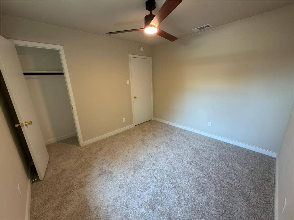 1834 Caldwell, Garland, TX 75041 Neutral-toned carpeting throughout