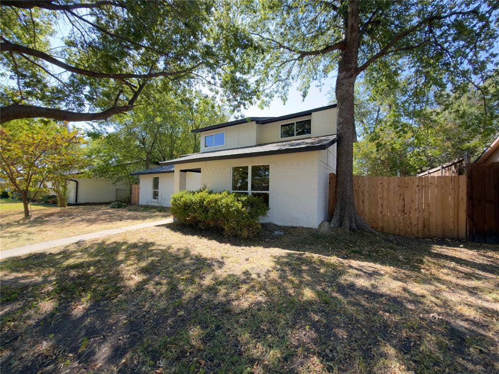 1834 Caldwell, Garland, TX 75041 Contemporary exterior with white brick, dark trim, and multiple windows