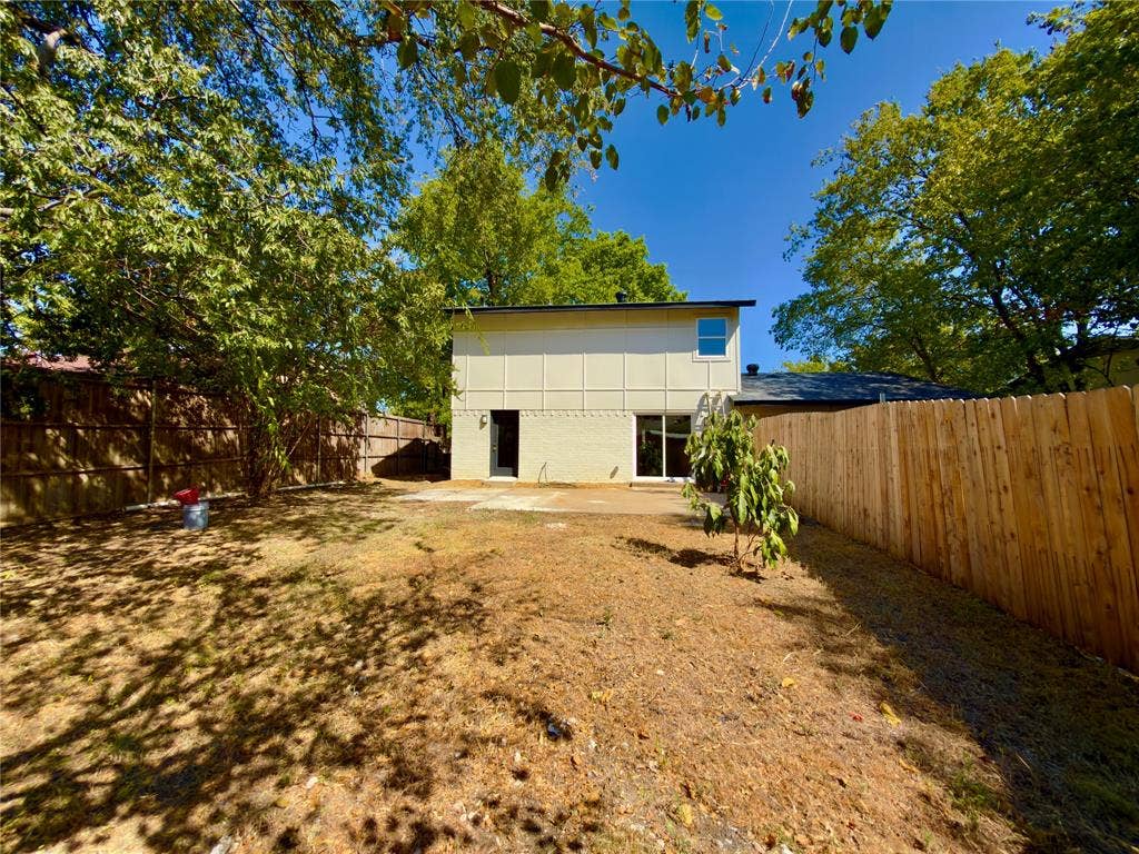 1834 Caldwell, Garland, TX 75041 Expansive yard with mature trees, offering privacy with full wood fencing