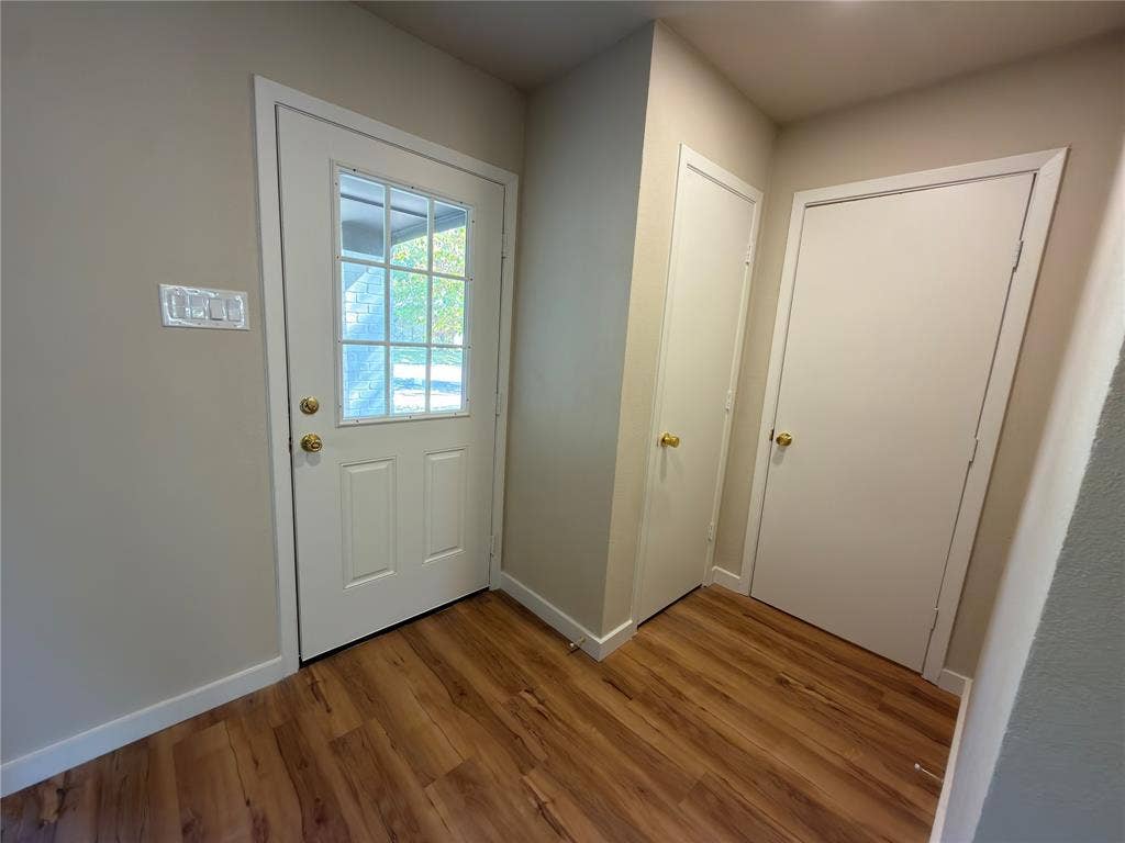 1834 Caldwell, Garland, TX 75041 Wood-finish flooring with neutral wall paint