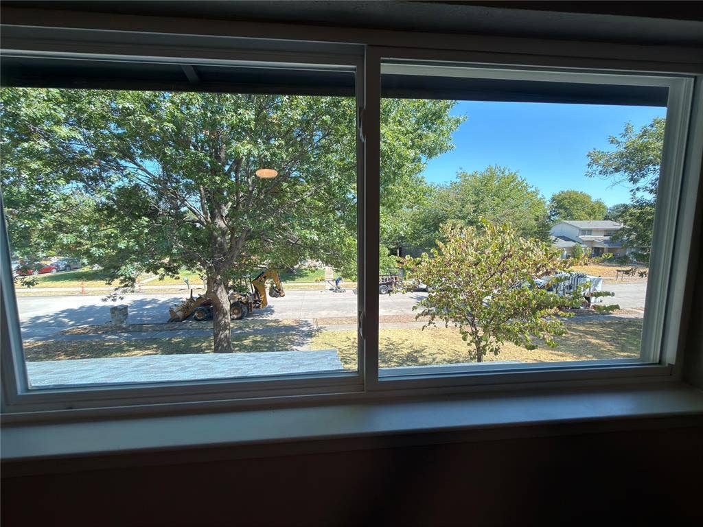 1834 Caldwell, Garland, TX 75041 Large window with a white frame and sill