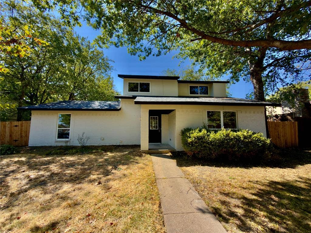 1834 Caldwell, Garland, TX 75041 Contemporary architectural style with a white brick exterior and dark trim