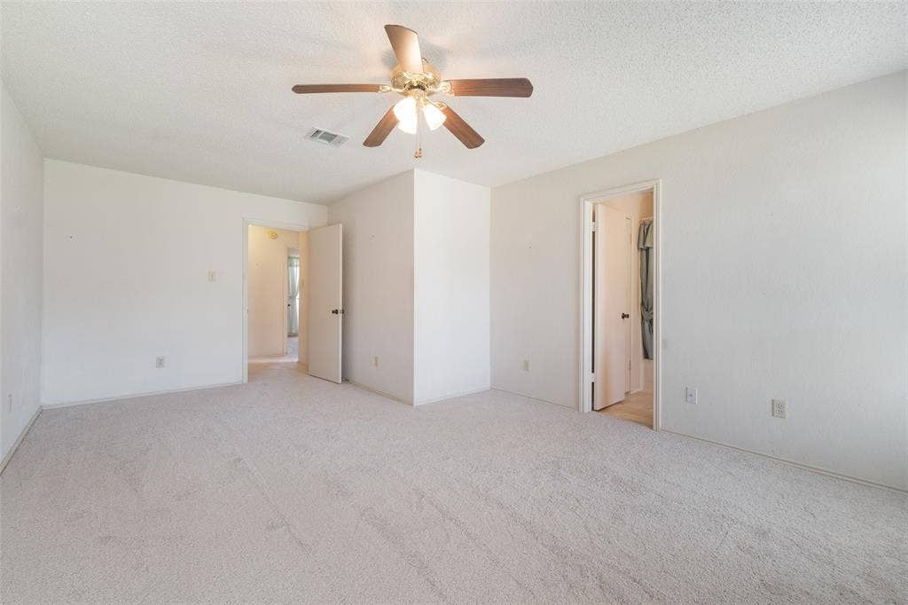 1002 Courtney Drive, Mesquite, TX 75150 Owners retreat looking towards hall entry. Sitting area is directly ahead.