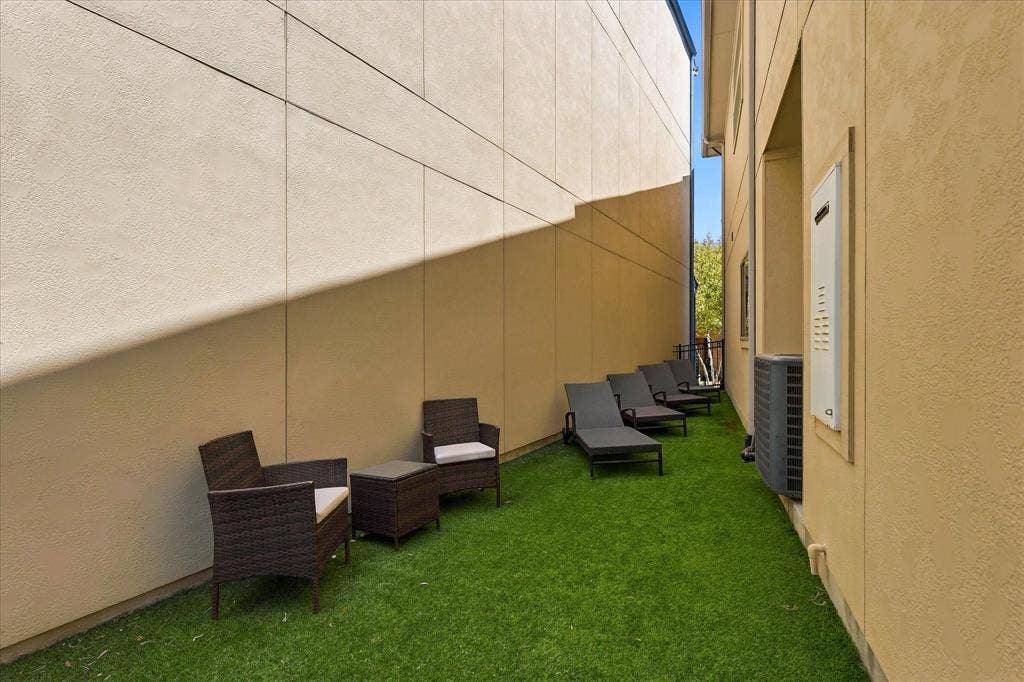This side yard is plenty big for people, pets, and play!