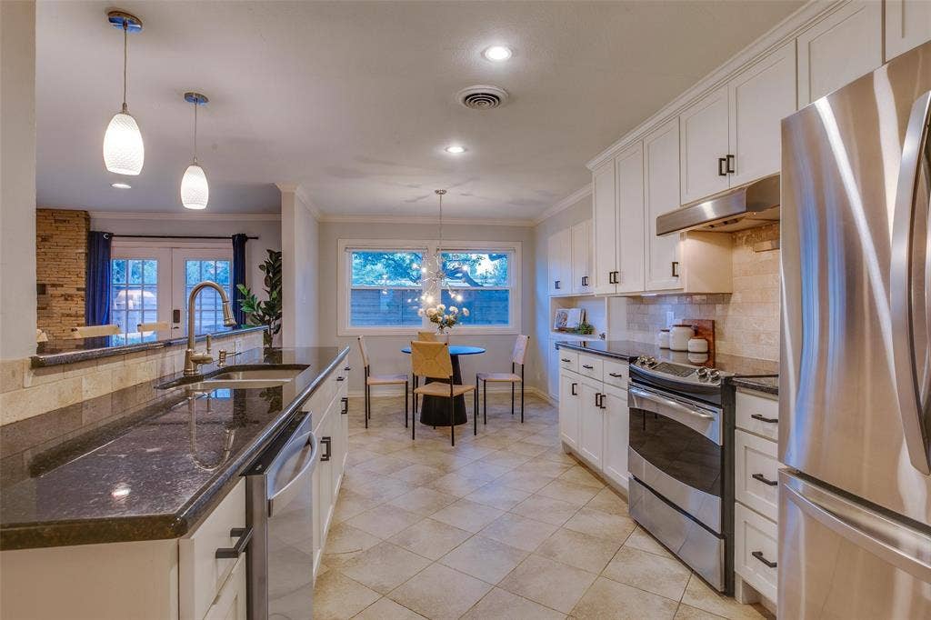3918 Royal Palms Court, Dallas, TX 75244 Thoughtfully renovated Kitchen offers exceptional workspace and storage.