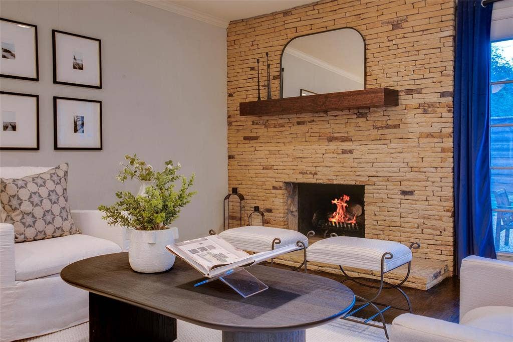 3918 Royal Palms Court, Dallas, TX 75244 Original stone fireplace brings warmth and Mid-Century character to the main Living Room.