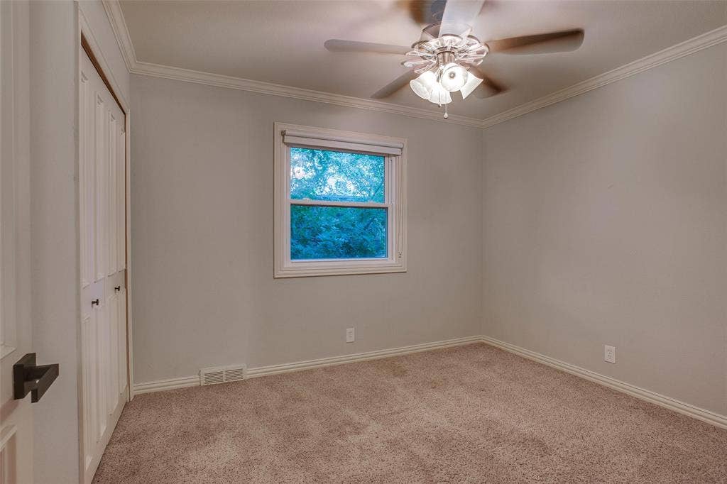 3918 Royal Palms Court, Dallas, TX 75244 Bedroom 2, one of three secondary bedrooms.