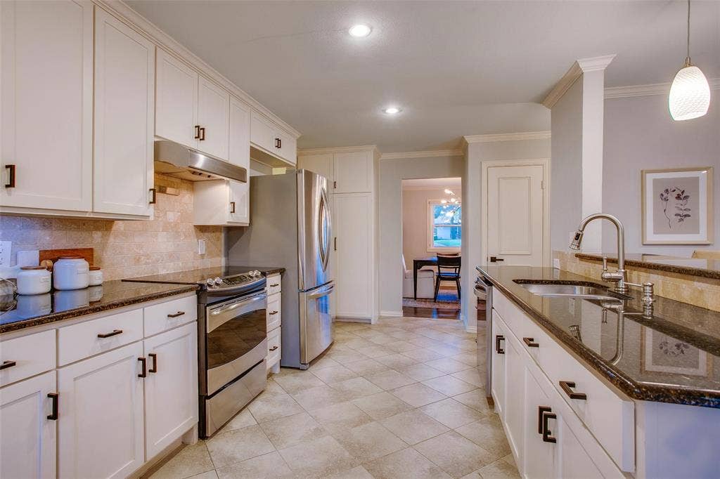 3918 Royal Palms Court, Dallas, TX 75244 Large Kitchen creates an easy connection between cooking, gathering and entertaining spaces.