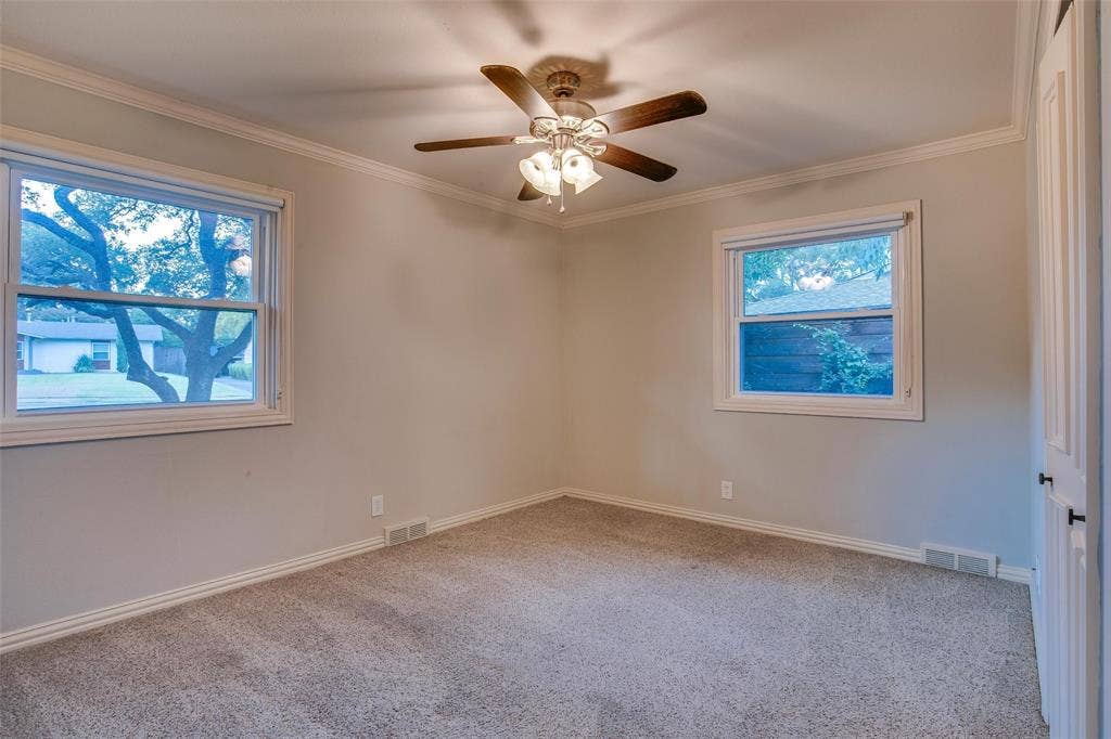 3918 Royal Palms Court, Dallas, TX 75244 Bedroom 3 with two windows bringing in abundant natural light.
