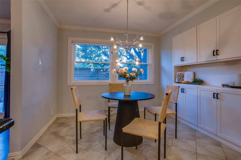 3918 Royal Palms Court, Dallas, TX 75244 Breakfast Room provides an inviting spot for casual dining just off the Kitchen, and features beautiful built-ins and cookbook storage.