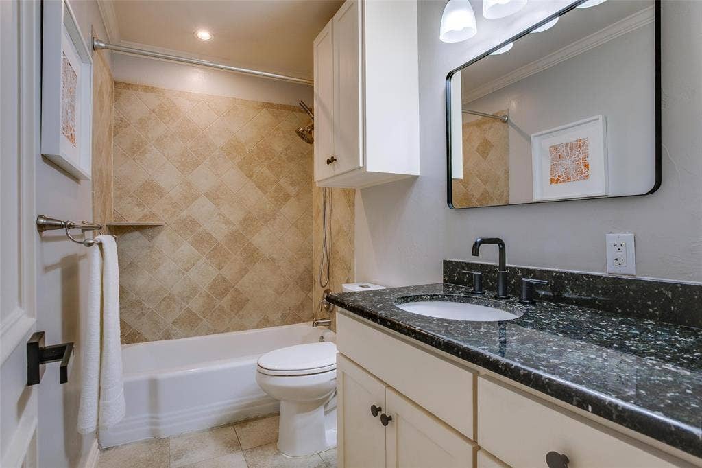 3918 Royal Palms Court, Dallas, TX 75244 Third fully renovated bath serves the secondary bedrooms.