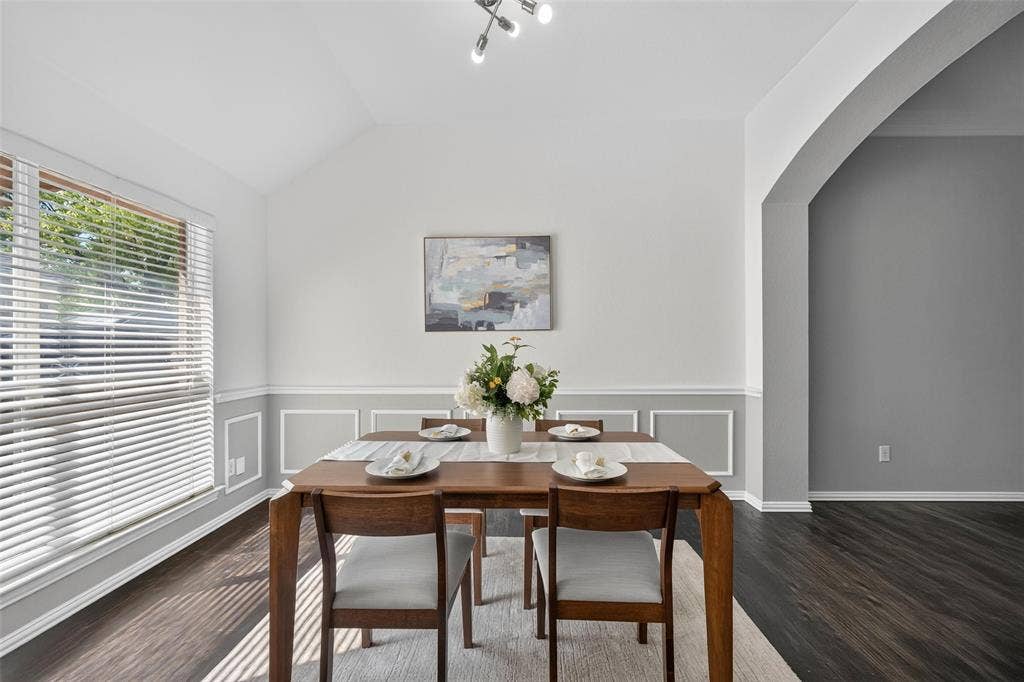 1102 Hartman Court, Arlington, TX 76006 Vaulted ceiling, recessed lighting, wood-finish flooring, accent wall paneling, and an arched entryway